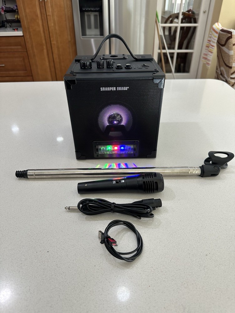 Sharper Image Model: SBT1050 Rechargeable Karaoke Singing System.