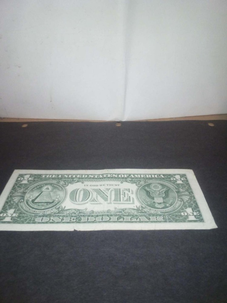 ERROR 1 DOLLAR BILLS, SLIGHT TEAR SEE PHOTO