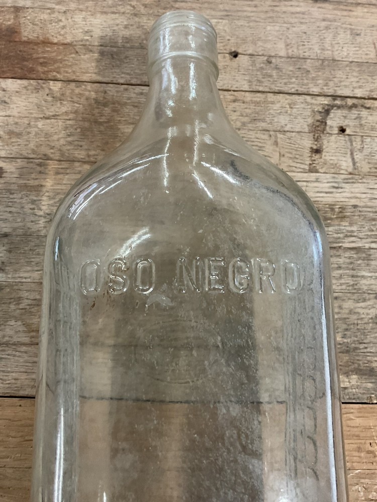 Antique OSO Negro glass bottle empty