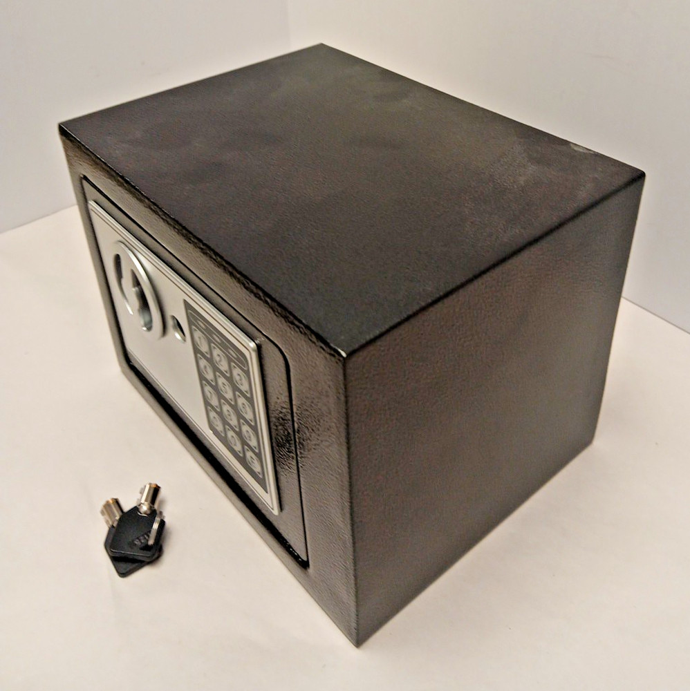 electronic security safe box with a keypad and key access.