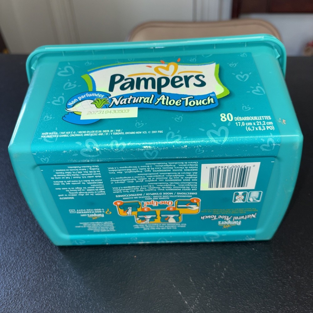 Empty Green Pampers Baby Wipes Container