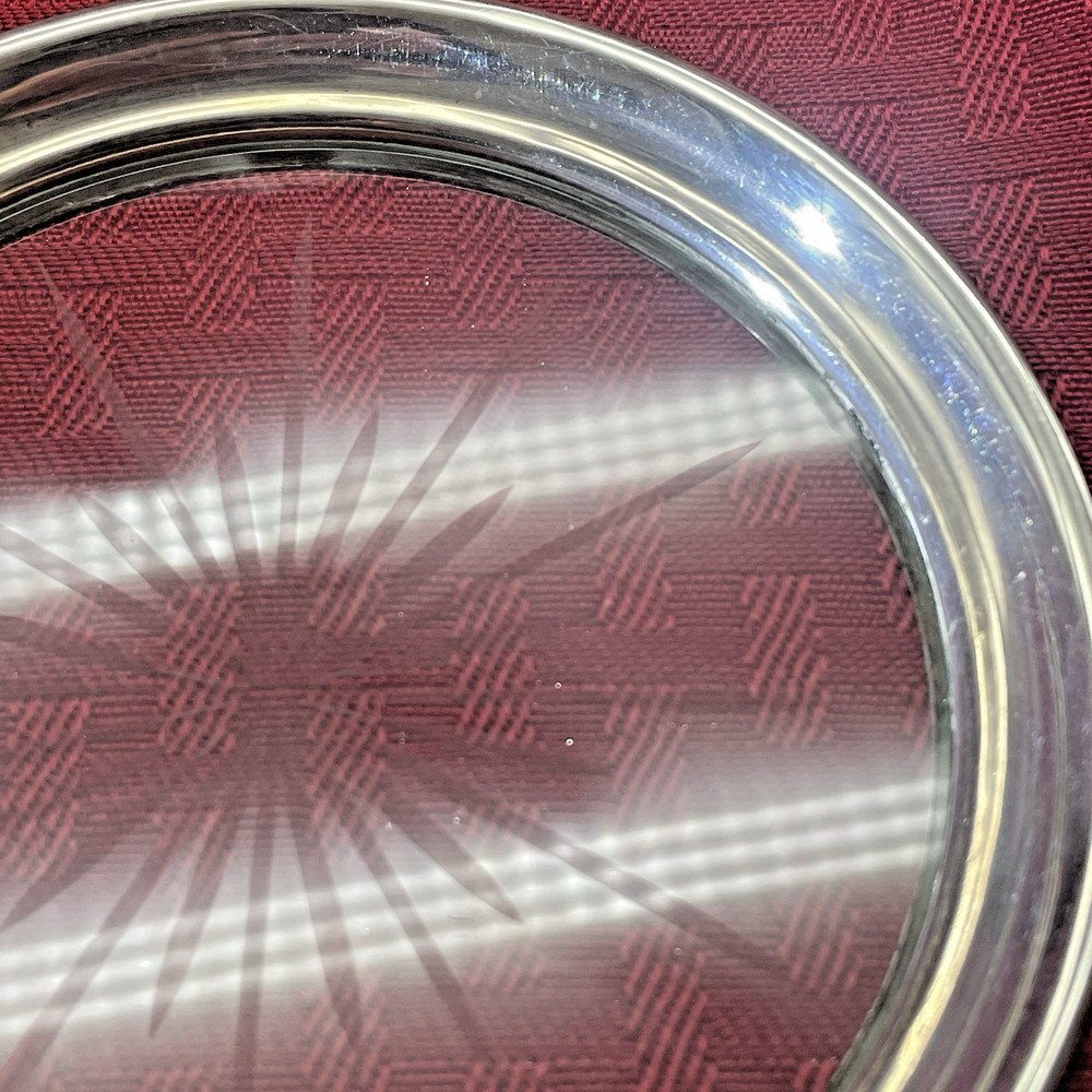 STERLING & GLASS BOTTLE COASTER WITH STARBURST PATTERN IN CENTER