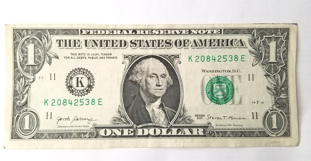 ERROR $1 dollar bill misaligned obverse top, Series 2017, good condition.