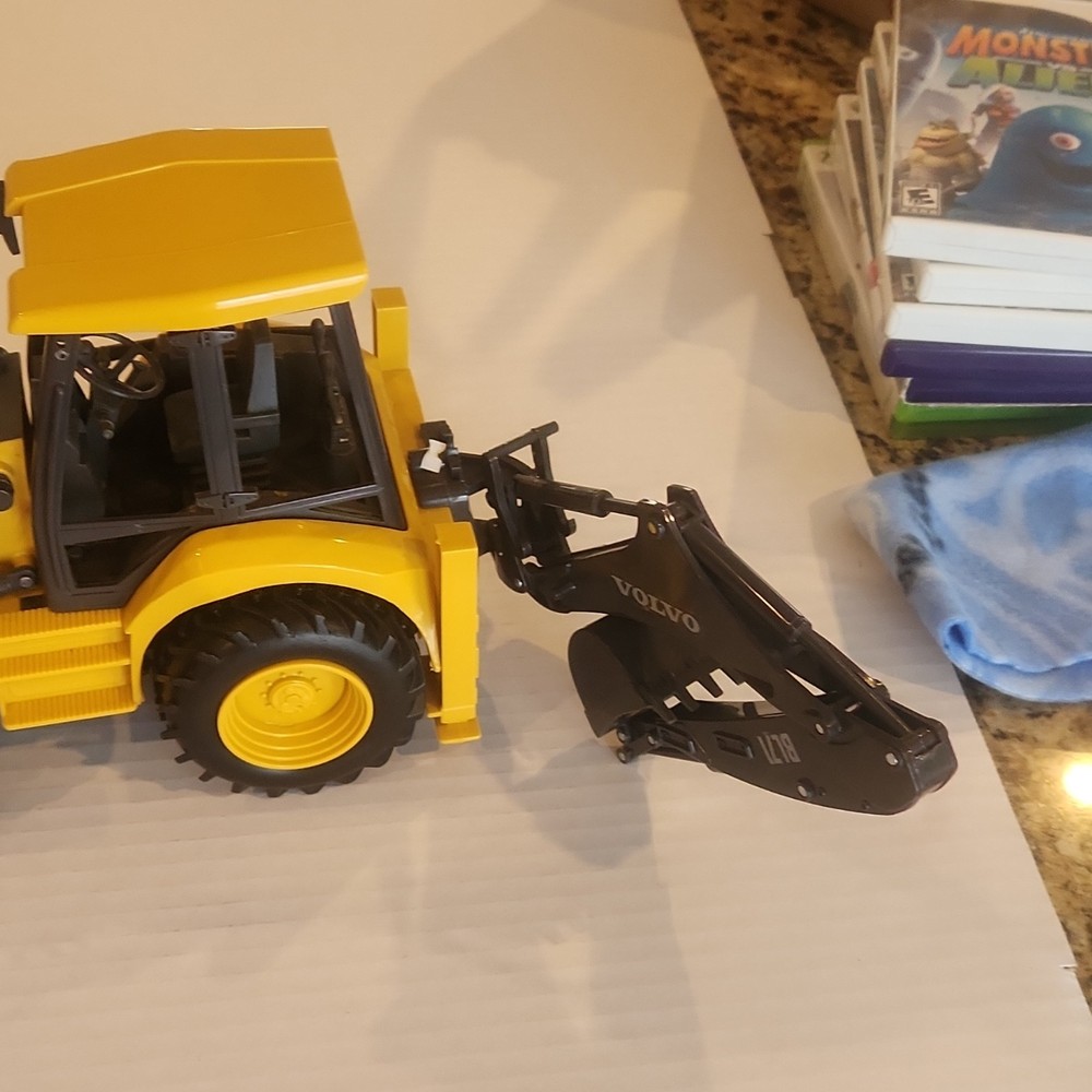 Volvo BL71 Backhoe Loader Plastic Toy Model Yellow Black