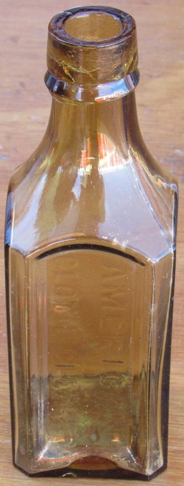 AMERICAN CLOTH CLEANER 6-1/2", LIGHT AMBER EMBOSSED GLASS BOTTLE