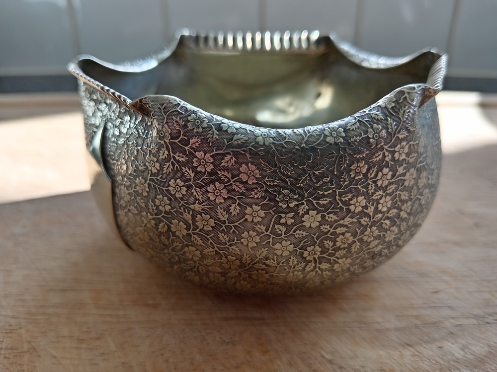 Silver plated very ornate rose bowl.