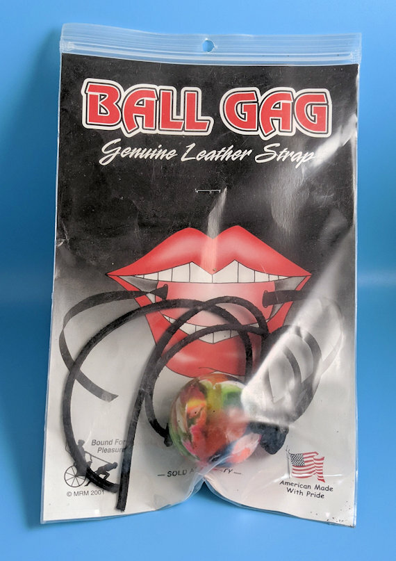 Colorful ball gag with leather strap.