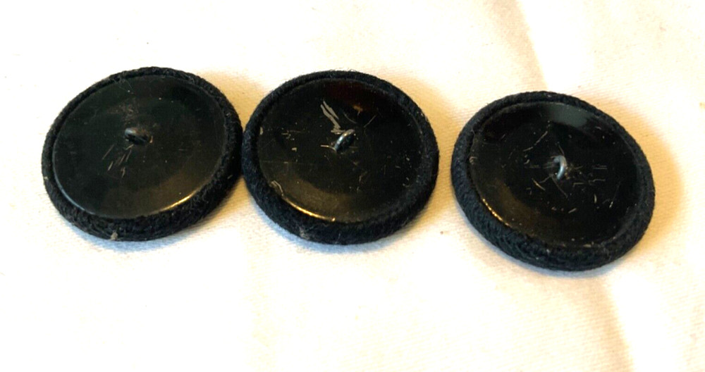 THREE FABRIC COVERED SHANK BUTTONS 1. 1/4”