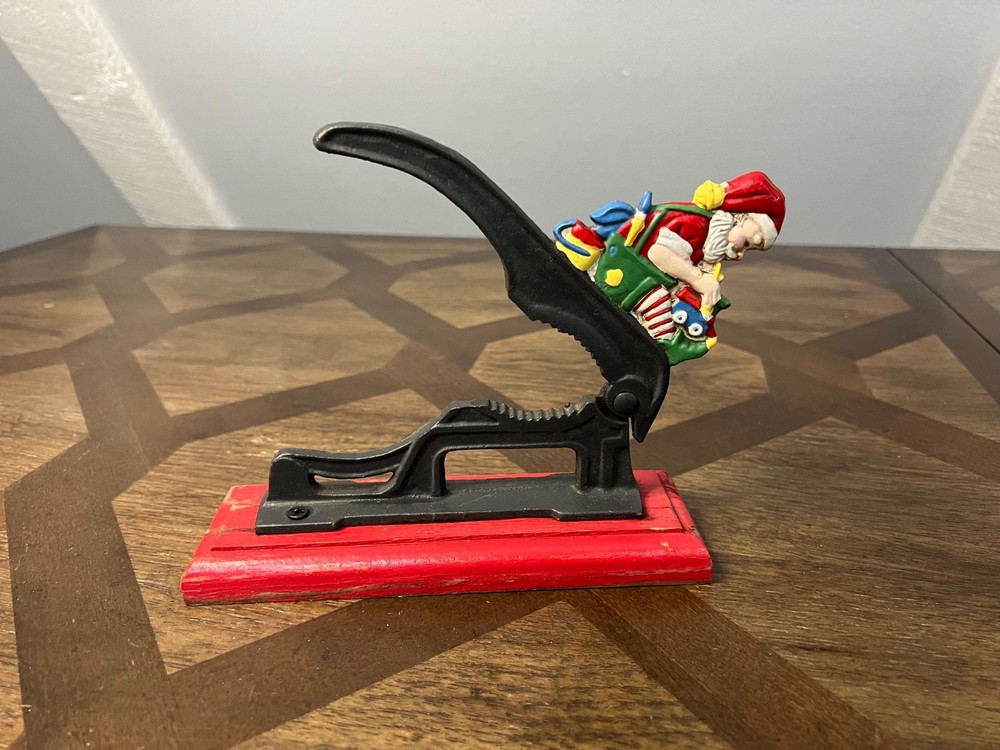 Old Fashioned Nutcracker Cast Iron on Wood Base santa theme nutcracker vintage