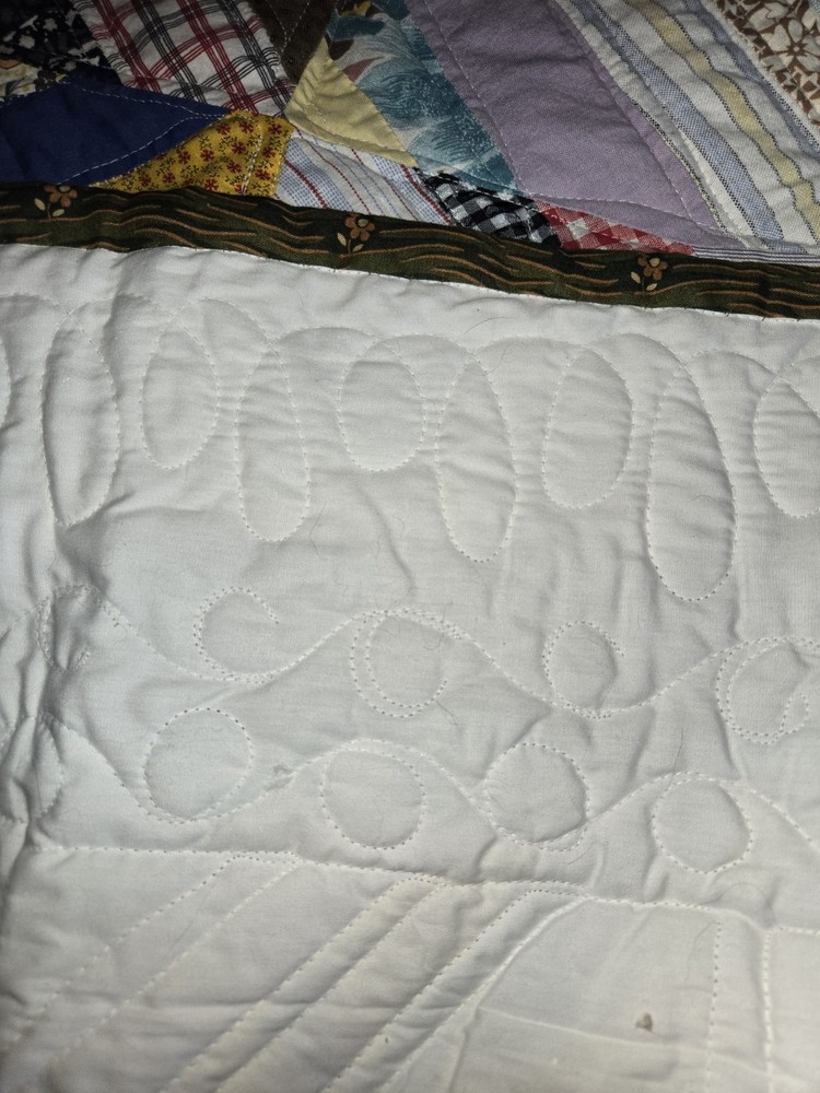 QUILT. 78X96. MACHINE QUILTED. 100 DIFFERENT PATTERNS