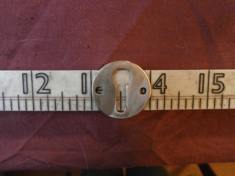 Vintage brass keyhole cover