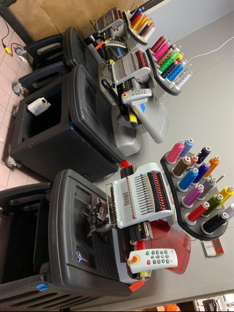 Four Melco embroidery machines.