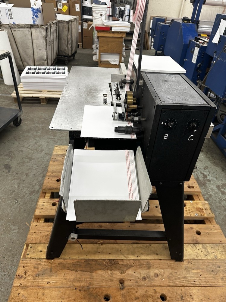 Scotty paper reinforcing Machine