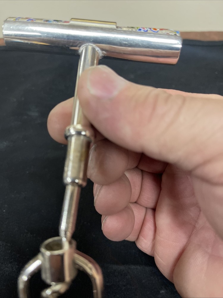 Silver corkscrew and bottle opener with blown glass insert