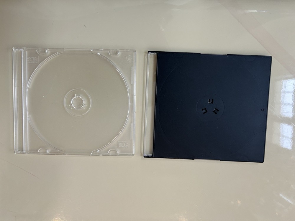 TWO (2) SLIM (ABOUT 1/4") CLEAR CD CASES