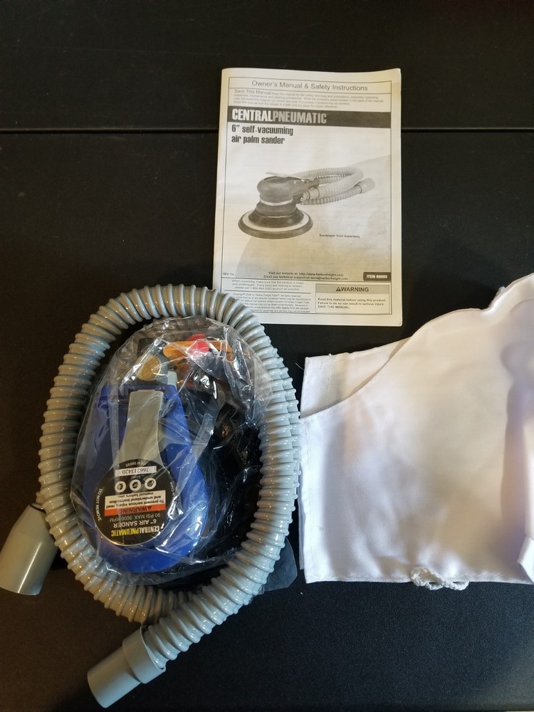 Self Vacuuming Air Palm Sander.