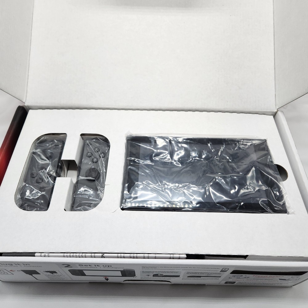 NINTENDO SWITCH MINT CONDITION INCLUDES JOYCONS WITH GRIP DOCK CHARGER HDMI