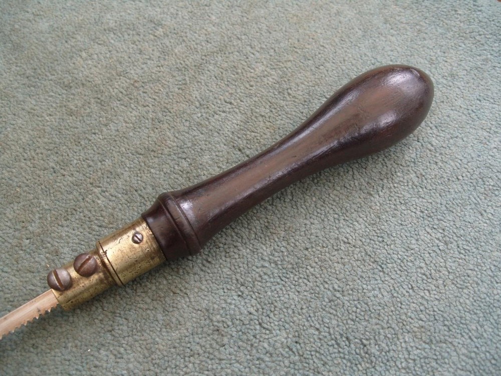Rosewood handled pad saw.