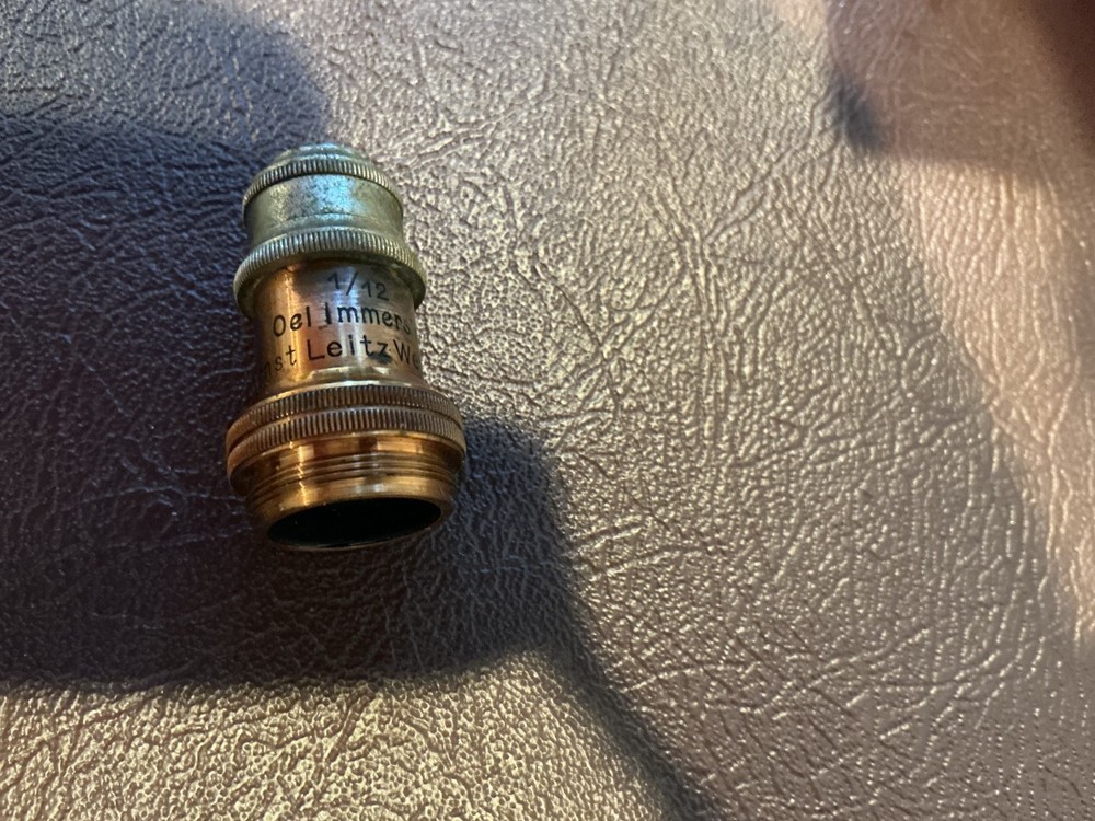 ERNST LEITZ MICROSCOPE WITH 3 OBJECTIVES AND CASE.