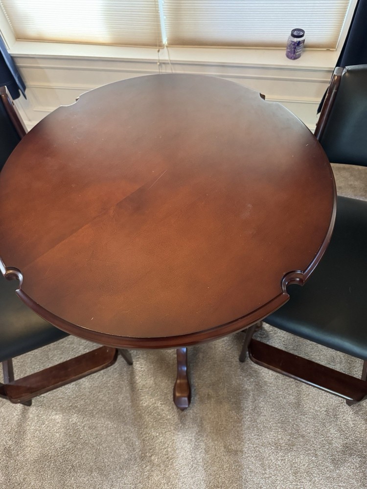 Pub table with kind of leather stools from Costco.