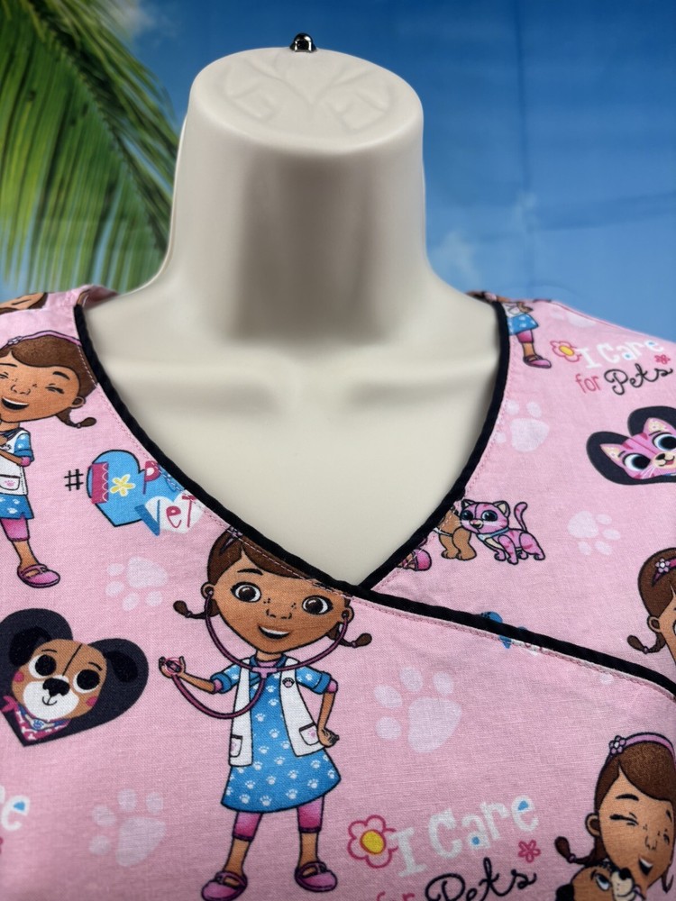Women’s Disney Doc McStuffins Pink Scrub Top Size Medium