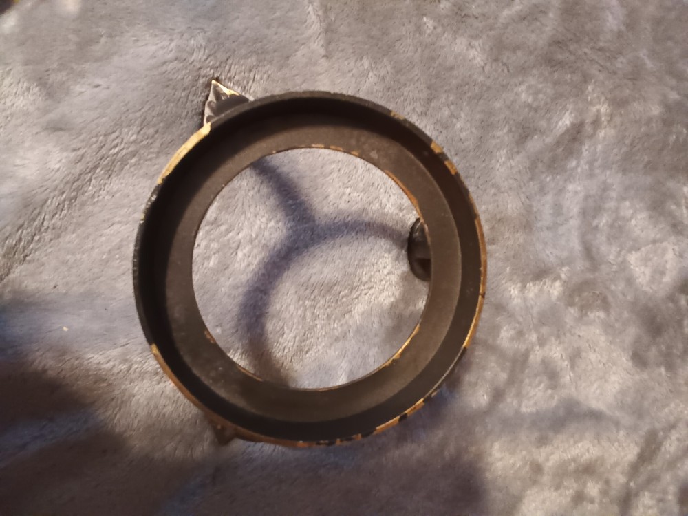 Brushed silver ball,or orb on painted brass base.