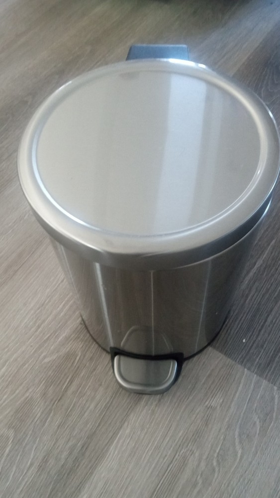 Small gray trash can