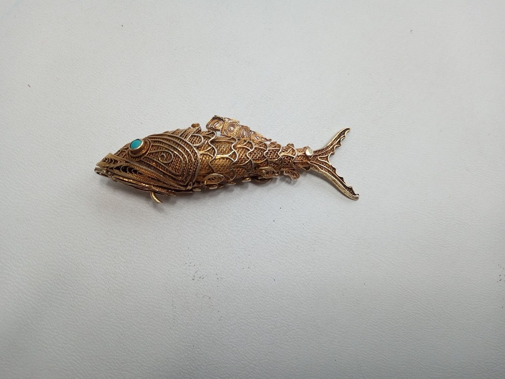 Tested as silver and gilded flexible fish, possibly pill box.