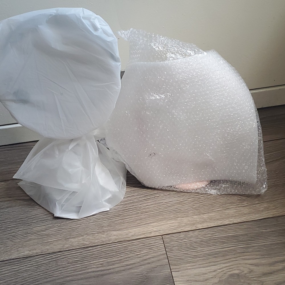2 mirrors protected by bubble wrap/ 1 tall and 1 short mirror
