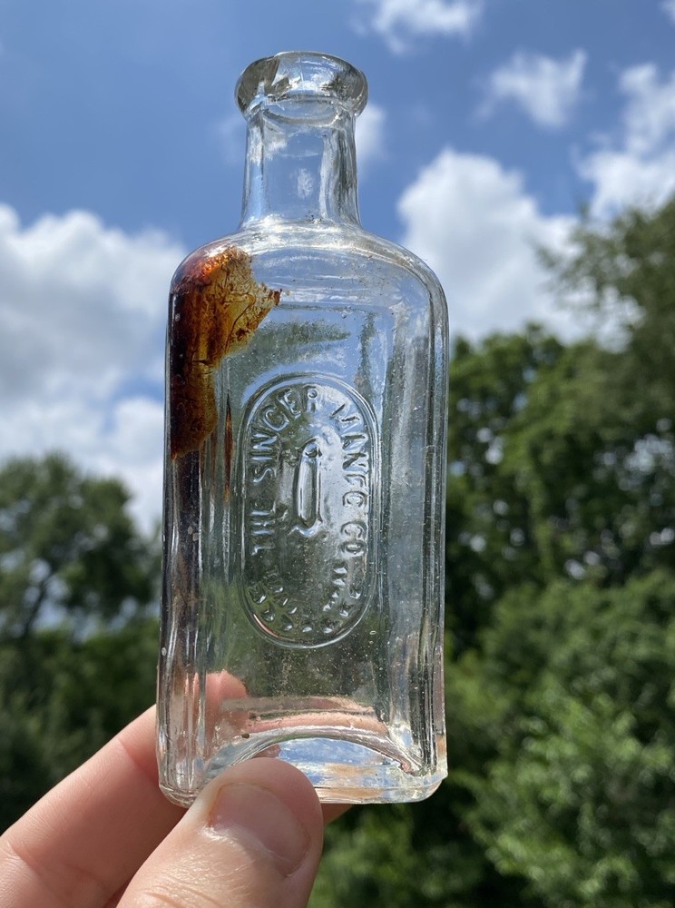 The Singer Sewing Machine Co Bottle