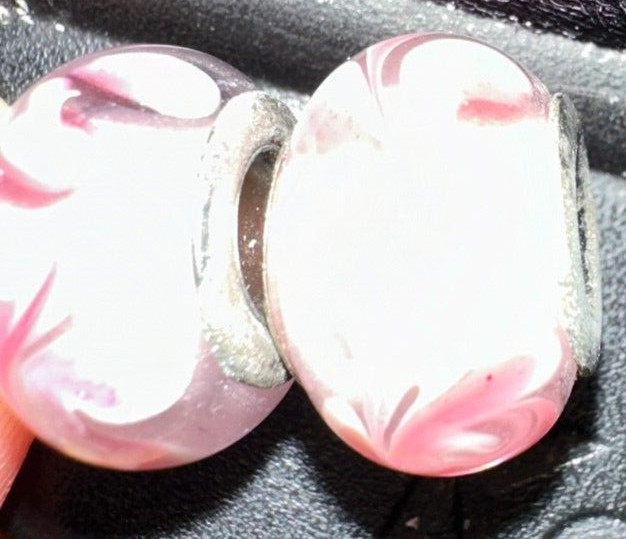 two matching pink patterned charms For Charm Braeclets