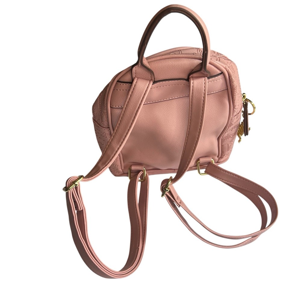 Backpack Elegant Juicy Couture backpack in blush. Embossed logo design. Includes