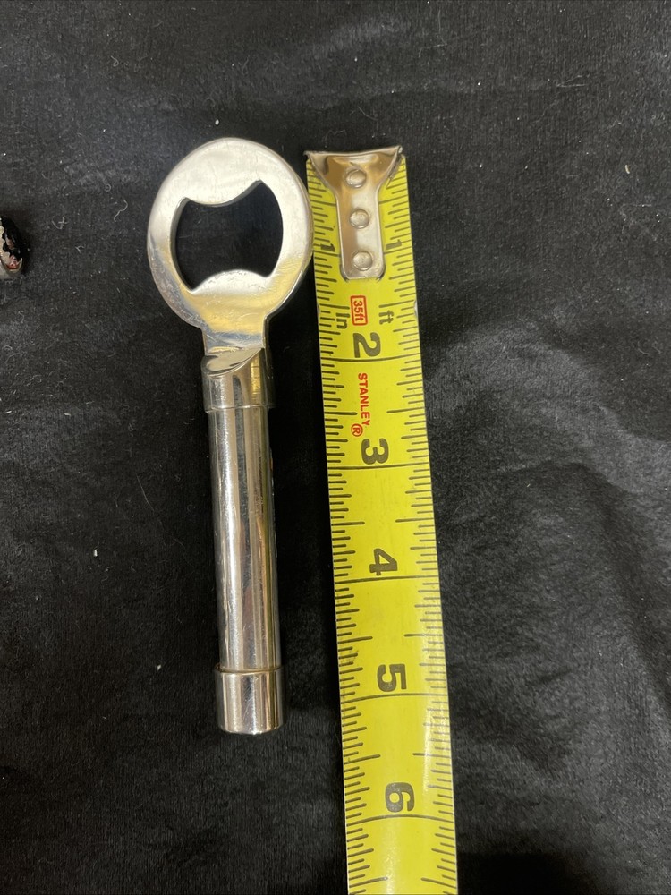 Silver corkscrew and bottle opener with blown glass insert