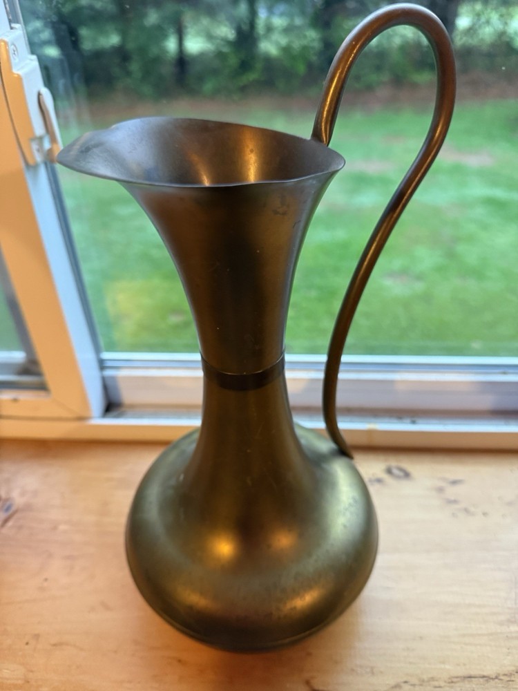 brass watering can