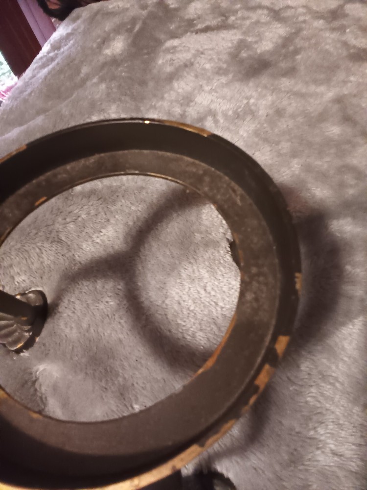 Brushed silver ball,or orb on painted brass base.