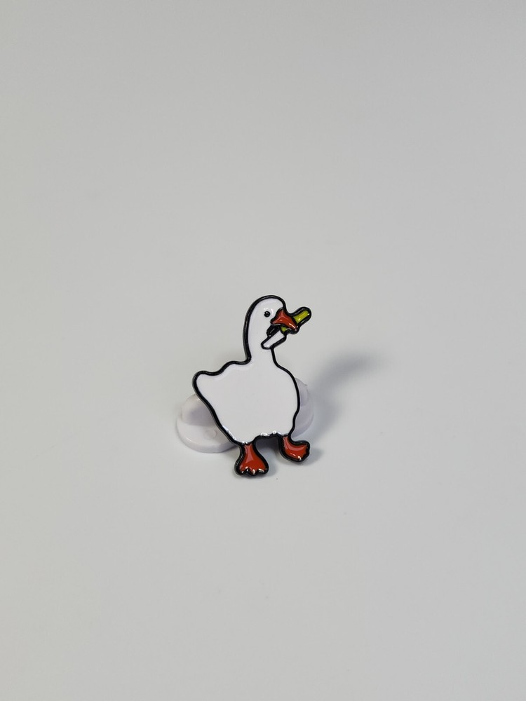 White Duck Holding a Knife Lapel Pin