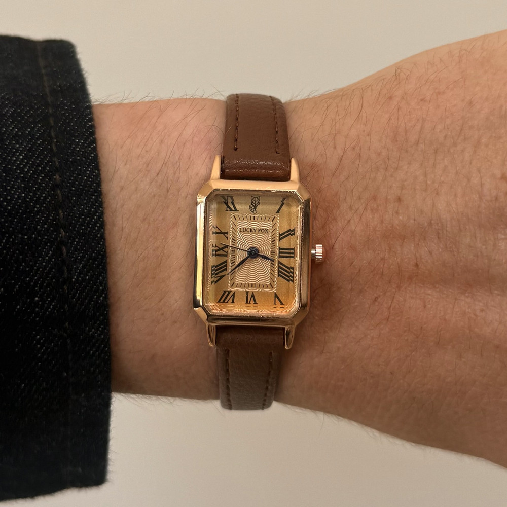 2000s vintage style rectangular gold luxury watch with leather band