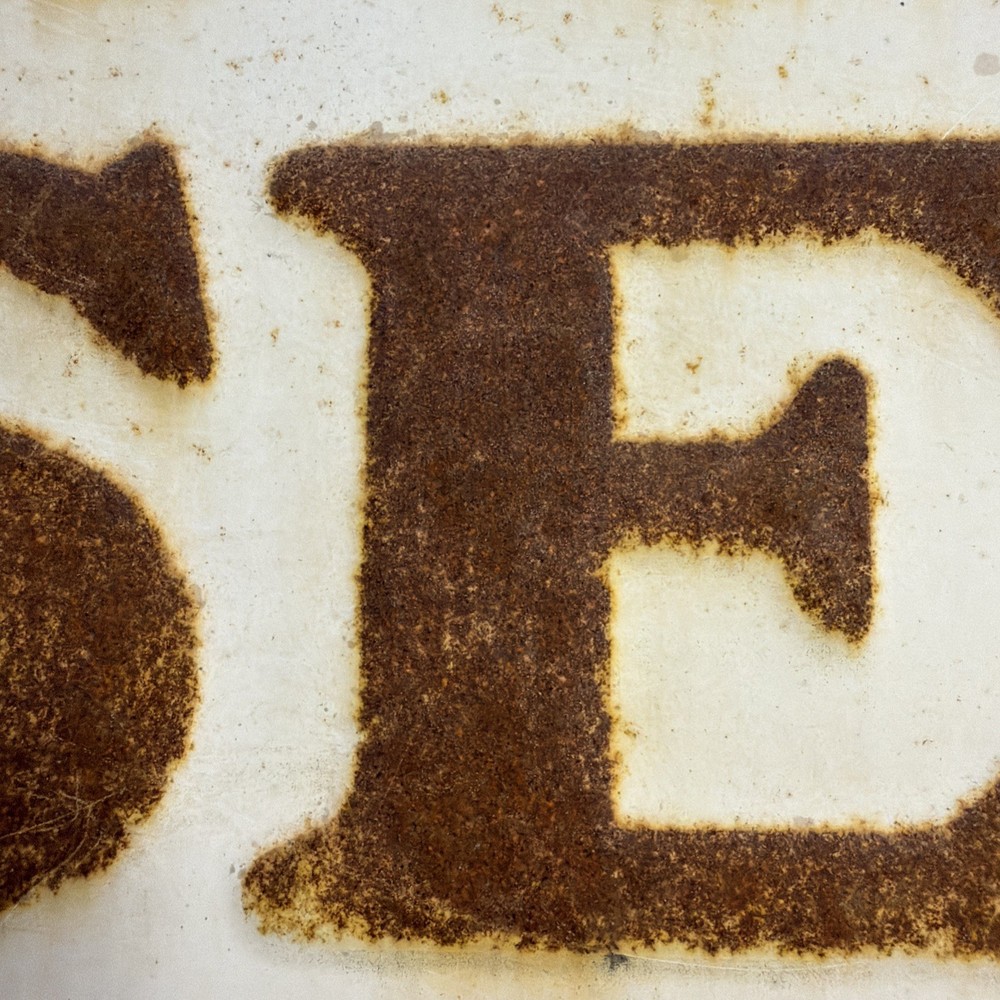 Woods Seeds Embossed Tin Sign