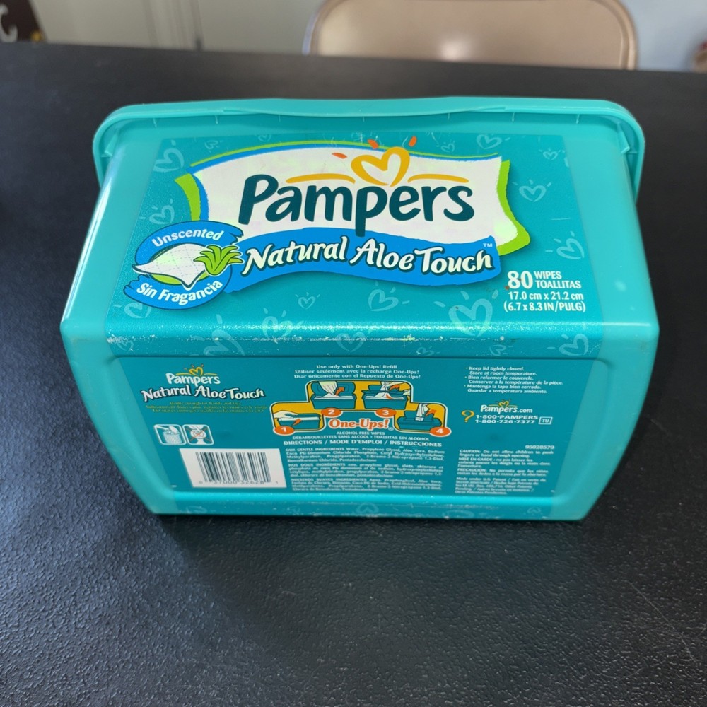 Empty Green Pampers Baby Wipes Container