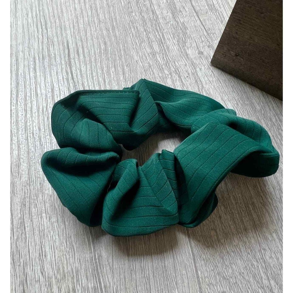 Leaf cosmetic bag with keychain and scrunchie.