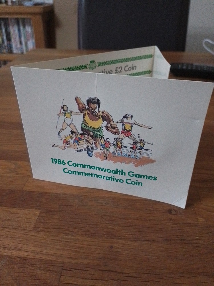 DAIRY CREST Complimentary Folder + UNC £2 1986 13th Commenwealth Games Coin