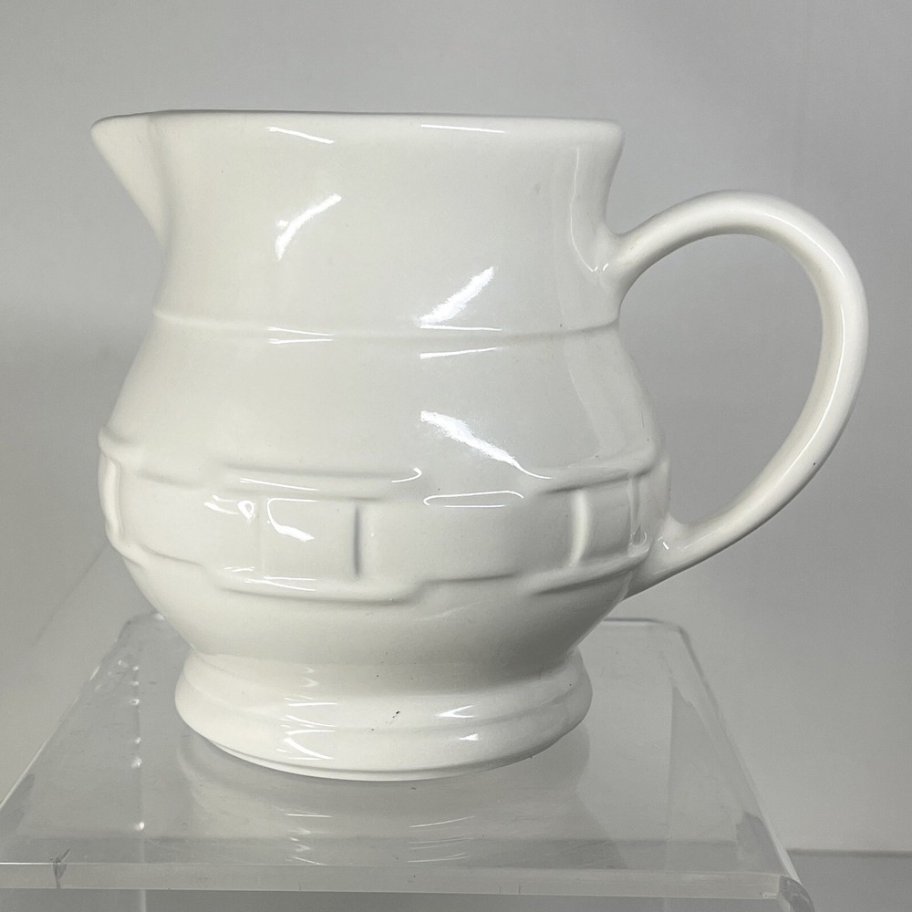 Longaberry Pottery Pitcher cream coloredrmbossed 5.5" tall 7.5" long