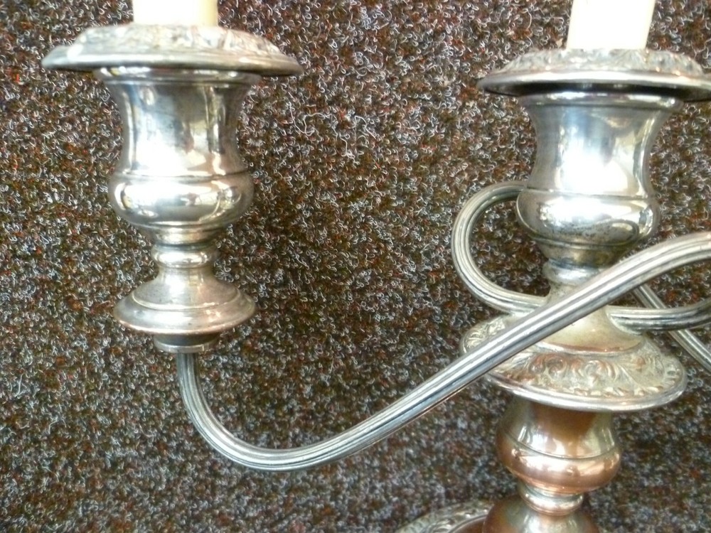 THREE VICTORIAN SILVER ON COPPER CANDLESTICKS, TWO STICKS AND ONE CANDELABRA