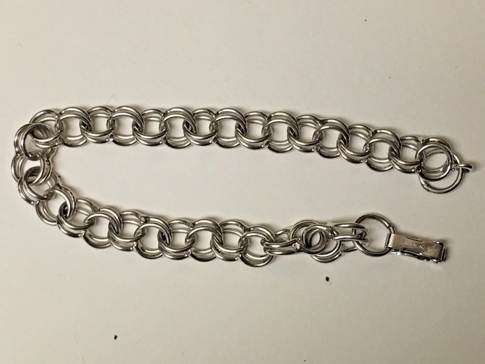 CHARM  STERLING BRACLET  SEVEN  INCHES