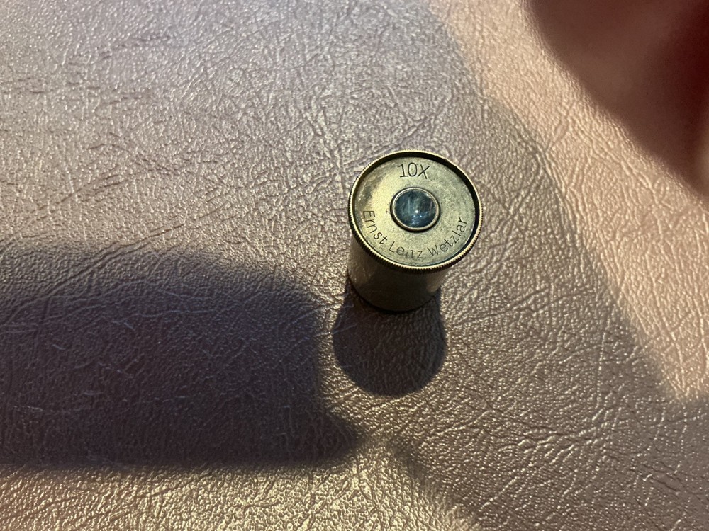 ERNST LEITZ MICROSCOPE WITH 3 OBJECTIVES AND CASE.