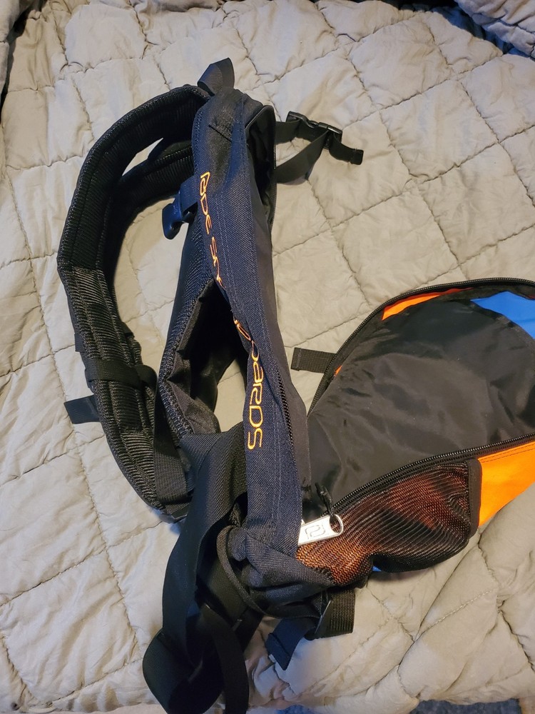 Ride Snowboards: Orange/Black Snowboarding heli-pack backpack