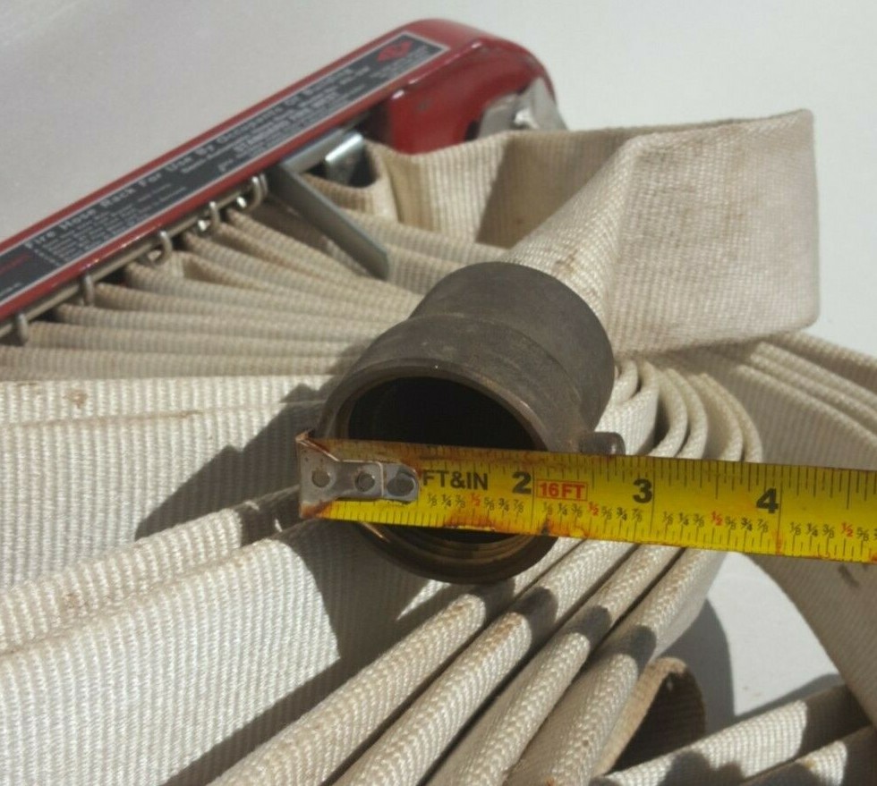 F-M Fireman Hose Rack with Fire Hose.