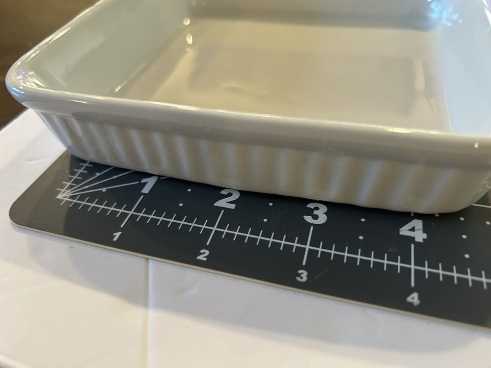 Pre-owned Dansk 6” square white ceramic baking dish.