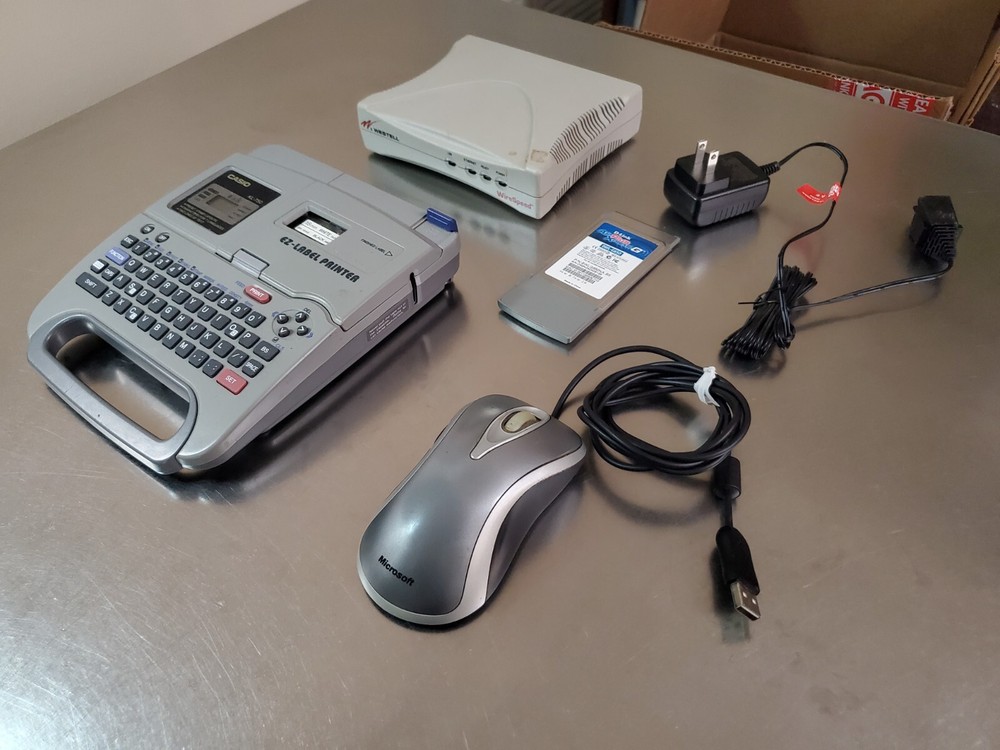 Lot of 5 Electronics Items: Casio, Microsoft, D-Link, Westell, Dirt Devil