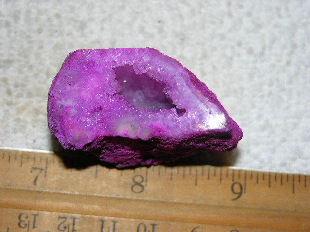 Geode cut & polished half with colored crystal center 2 inch E2